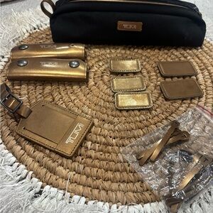 TUMI Black and Gold luggage accessory Bag Set